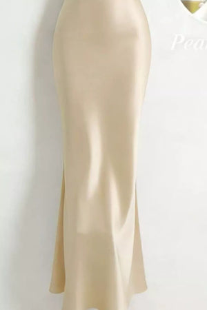 Khaki satin maxi dress with cowl neck and pearl embellishments.