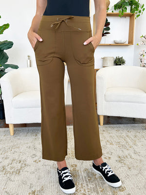 Brown utility pocket wide-leg lounge joggers with drawstring waist and pockets.