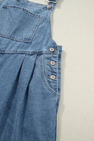 Denim wide-leg jumpsuit with button details and pleats.