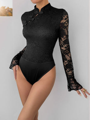 Black lace bodysuit with mandarin collar, frog closures, and bell sleeves.