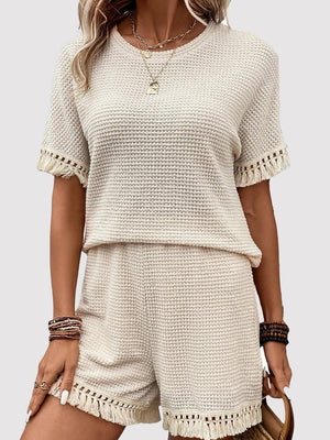 Cream waffle knit set with fringe trim shorts and short sleeve top.