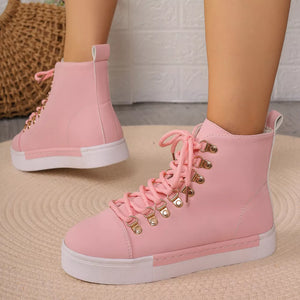 Pink lace-up platform sneakers with d-ring eyelets and white soles.