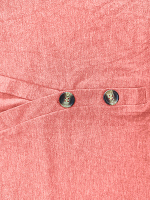 Buttoned henley slouch tee in burnt coral with crossover detail and two decorative buttons.