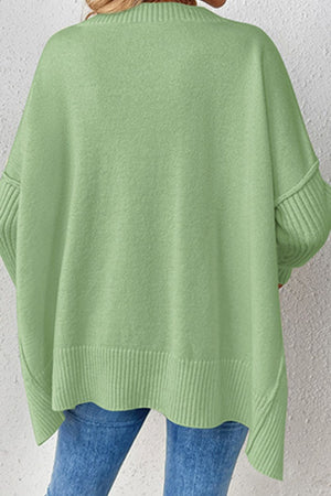 Light green acrylic knit sweater with V-neck and asymmetric hemline