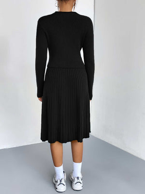 Black ribbed knit fit-and-flare co-ord with long sleeves and A-line skirt.