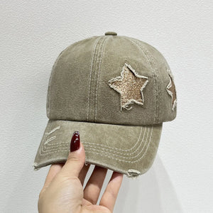 Khaki baseball cap with distressed stars and frayed brim detail.