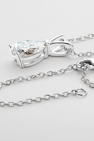 Silver pear cut moissanite pendant necklace with delicate chain.