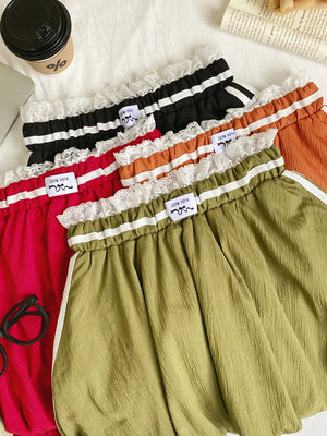 Lace-trimmed gathered waist mini skirts in red, army green, orange, and black with white stripe detail.