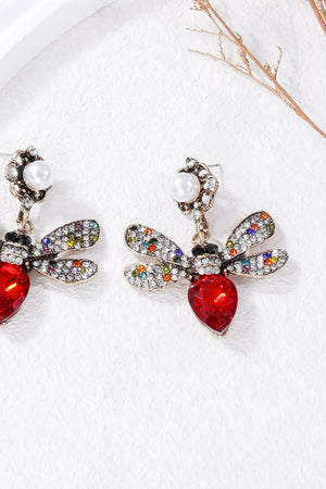 Red jeweled dragonfly chandelier earrings with colorful crystal wings and pearl accent