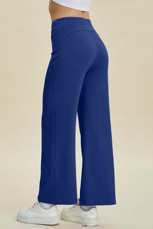 Blue wide leg lounge pants with a soft drape and high waist.
