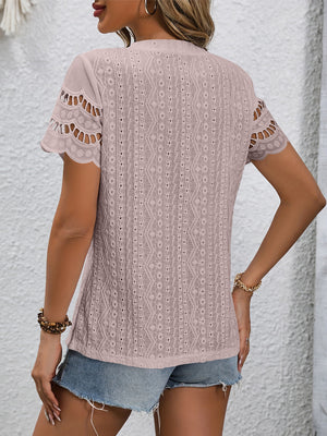 Pink blouse with eyelet detail and scalloped short sleeves