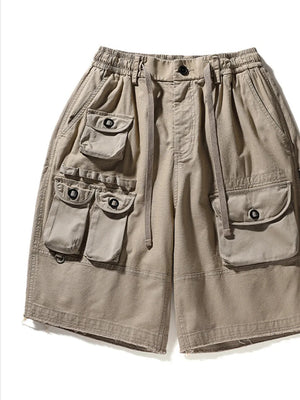 Khaki men's cargo shorts with drawstring waist and multiple utility pockets.