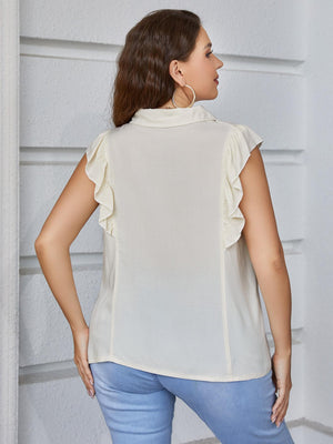 Light yellow collared blouse with ruffled cap sleeves.