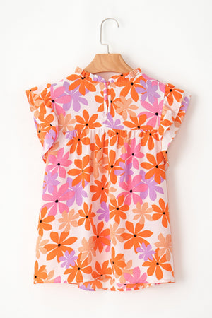 Multicolor floral blouse with smocked bodice, ruffled neckline and flutter sleeves.