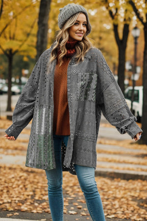 Charcoal lace panel shacket with voluminous sleeves and button front, styled open over a rust sweater.