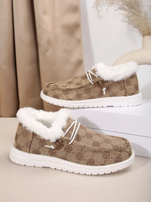 Southwestern print faux fur lined loafers in taupe with white laces and wooden bead detail.