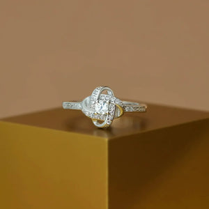 Silver intertwined crystal knot ring with pavé band.