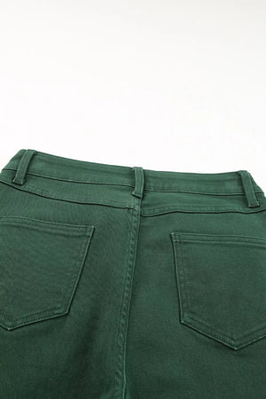 Green cotton straight-leg jeans with crossed v-waist detail and back pockets.