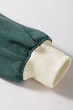 Dark green sweatshirt sleeve with cream ribbed cuff detail