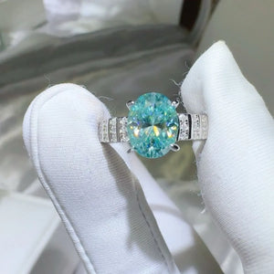 Aquamarine halo oval ring with diamond band