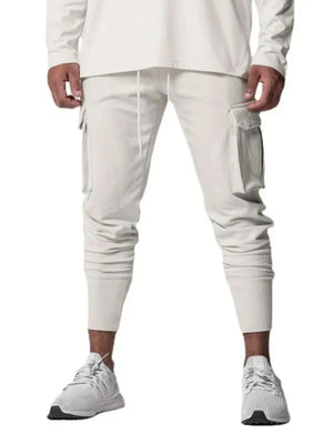 Tech-Knit cargo joggers in white with drawstring waist and zip pocket detail.