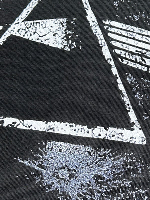 Black cotton blend t-shirt with a distressed white geometric graphic print.
