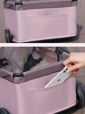 Pink foldable pet stroller bag with mesh canopy and exterior pocket holding a smartphone.