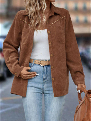 Brown corduroy shirt jacket with studded shoulders and button front.