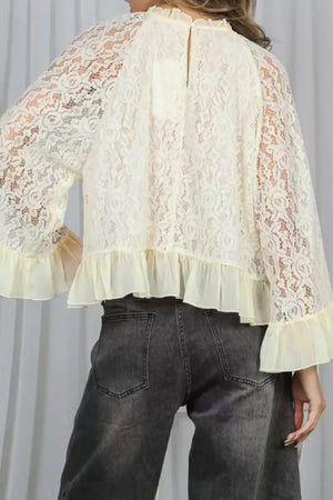 Cream floral lace maternity shirt with bell sleeves and ruffled hem detail.