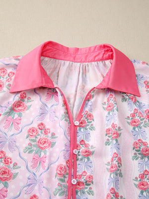 Pink floral and bow print maternity shirt with ruffled button-up front and contrast collar.