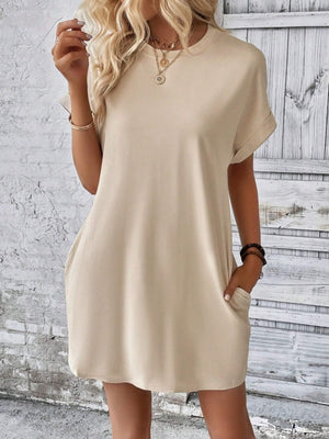 Tan relaxed tee dress with cuffed sleeves and pockets, casual crew neck shift dress