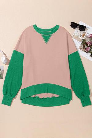 Chic Contrast Crewneck Sweatshirt in pink with green sleeves and trim, featuring a V-stitch detail.