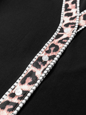Black blouse with leopard print trim and white buttons
