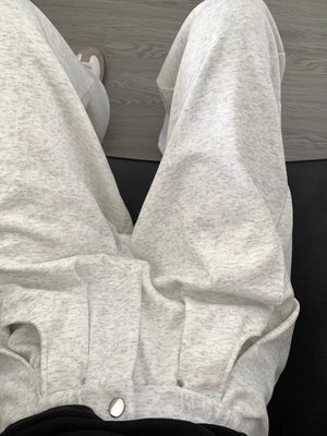 Men's gray heather wide-leg sweatpants with adjustable drawstring and pockets.