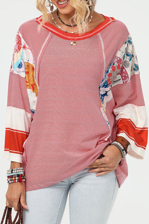 Patchwork stripe raglan sleeve tee in deep red with colorful boho print accents.