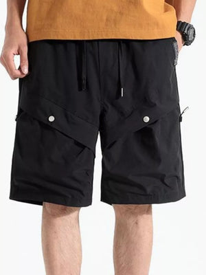Black relaxed fit cargo shorts with drawstring waist and button flap pockets.