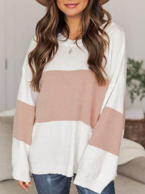 Colorblock knit pullover sweater in blush pink and white with drop shoulders.