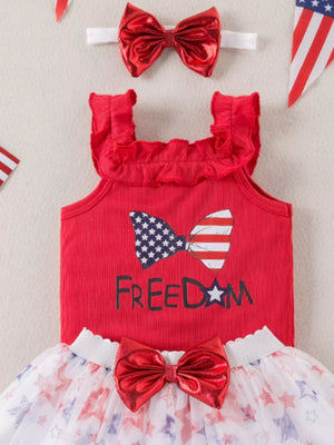 Red ruffled tank top with patriotic bow graphic and star print tulle skirt.