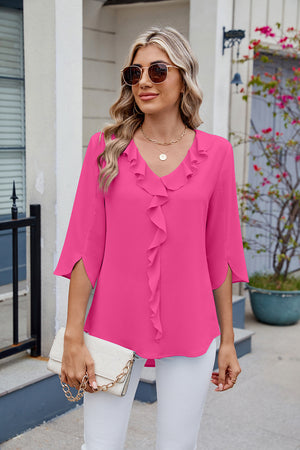 Hot Pink V-neck blouse with ruffled front and flutter sleeves.