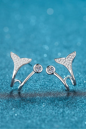 Silver whale tail stud earrings with crystal accents and a round gem stud.