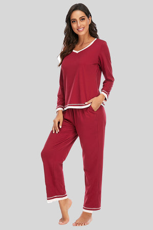 Wine V-neck long sleeve pajama set with white trim and pockets.