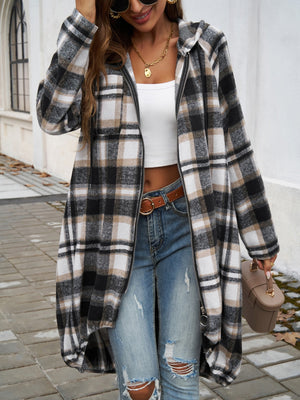 Draped plaid cocoon hoodie jacket in black, brown, and white plaid with a zip front and hood.