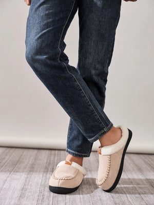 Suede shearling-lined moccasin slides in caramel with contrast stitching and pull tab.