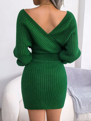 Green wrap knit bodycon mini dress with V-neck and long sleeves.