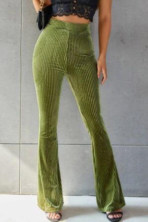 Ribbed velvet palazzo trousers in Matcha Green, high-waisted with a flared leg.