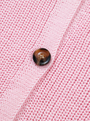 Pink acrylic button front sweater vest with V-neck detail.