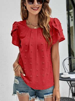 Red textured puff sleeve blouse with dot pattern and gathered neckline.