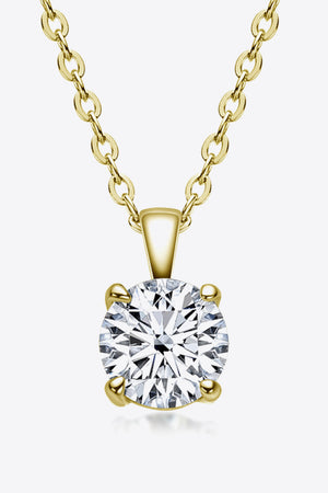 Gold chain necklace with a round brilliant-cut solitaire diamond pendant.