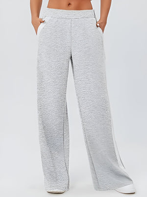 Light gray palazzo trousers with contrast white side panels and textured fabric.