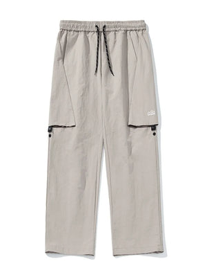 Gray cargo pants with elastic waist, drawstring, and multiple pockets.